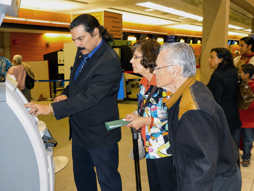 Peter Samuel helping travellers as a Calgary travel agent